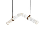Niori Zareon LED Small Chevron suspension light with angled alabaster cylinders, brushed brass cuffs and twin black cables on a white background.