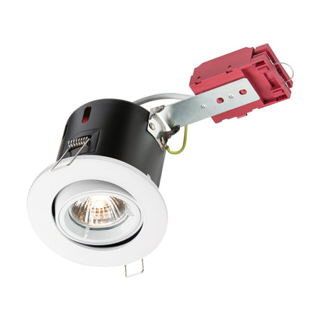 The Fire-Rated Tilt Downlight - White boasts a recessed ceiling fixture equipped with a white trim, black interior housing, and a red electrical box. The GU10 bulb is visible within the housing, and it comes with a metallic bracket to facilitate easy installation.