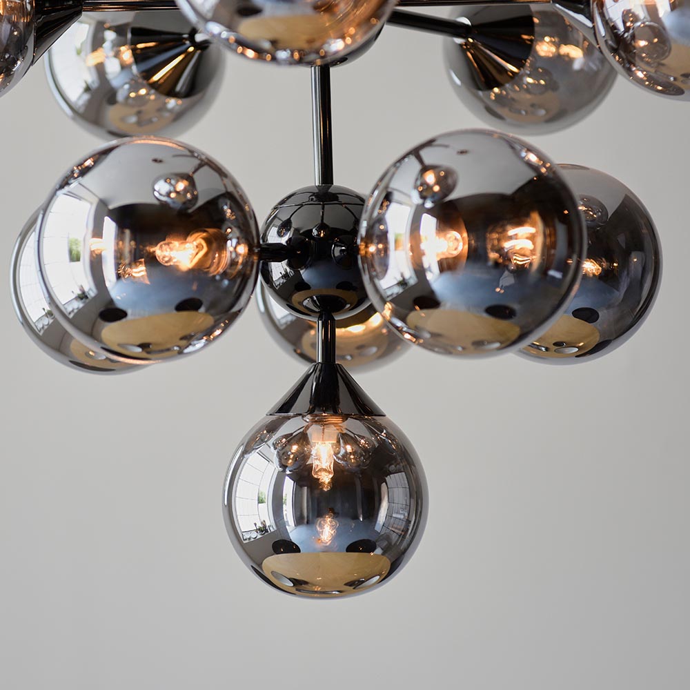 Close-up of Endon Fitzroy 11 Light Pendant in chrome and black, showing clustered smoked mirror glass globe shades on slim arms against a light grey background.