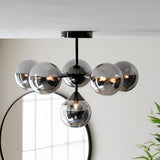 Endon Fitzroy 6 light semi-flush ceiling light in black chrome with smoked glass globes, mounted above a round black-framed mirror.