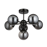 Endon Fitzroy 6 light semi-flush ceiling light in black chrome with brass frame and smoked glass globe shades on a white background.