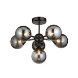 Endon Fitzroy 6 light semi-flush ceiling light in black chrome with smoked glass globes on a sputnik-style brass frame, shown on a white background.