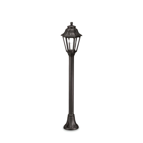 Introducing the Gaze 1 Light Lamp Post in Black: a tall, elegant outdoor fixture with a vintage appeal. It boasts a lantern-style top featuring clear panels and an intricately designed post, enhanced by an anti-yellowing diffuser. The lamp stands unlit against a plain white backdrop.