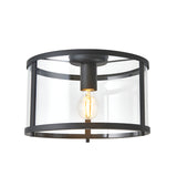 Endon Ellery flush ceiling light in black with a cylindrical clear glass shade and single E27 filament bulb, shown on a plain white background.