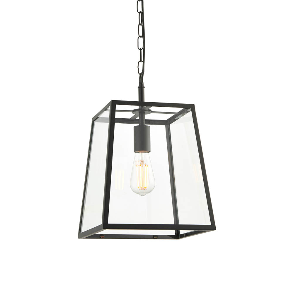 Brenton Lantern Pendant in black, a tapered box-frame ceiling light with clear glass panels and exposed filament bulb, hung from a chain.