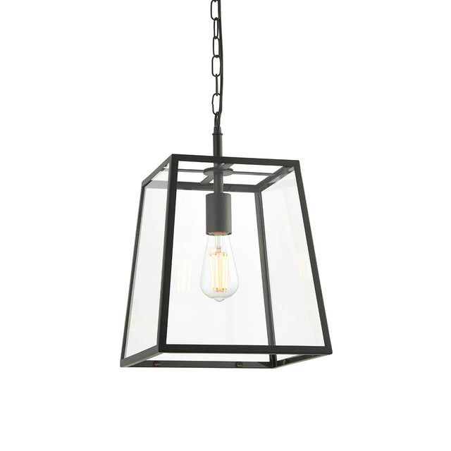 Brenton Lantern Pendant in black, a tapered box-frame ceiling light with clear glass panels and exposed filament bulb, hung from a chain.