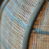 Close-up of the Endon Daneshaw table lamp shade, showing the handmade woven natural linen and bamboo texture in soft focus.