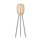 Daneshaw Floor Lamp in black and natural with a lantern-shaped woven bamboo and linen shade on a matt black tripod base.