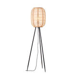 Daneshaw Floor Lamp with a natural woven bamboo and linen lantern shade on a matt black tripod base, shown lit against a white background.