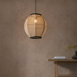 Daneshaw Pendant Light in black and natural linen, spherical shade with matt black trim rings, hanging lit above a wooden console table.