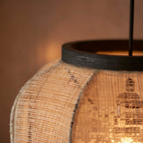 Close-up of the Endon Daneshaw pendant showing its handmade natural linen shade, matt black wooden rim, and glowing E27 filament bulb within.