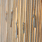 Close-up of the Endon Salcombe pendant's woven natural seagrass shade, showing the vertical grain lit with a warm glow.