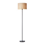Endon Salcombe floor lamp with a slim matt black metal stem, round base and woven natural seagrass drum shade, shown on a plain white background.