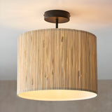 Endon Salcombe semi-flush ceiling light with woven seagrass drum shade and matt black metal fitting, illuminated against a neutral background.