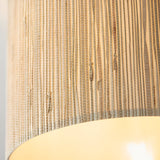 Close-up of the Endon Salcombe semi-flush ceiling light showing the woven seagrass shade texture and warm glow from the E27 lamp within.