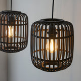 Endon Bracken pendant lights with black bamboo cage shades and warm filament E27 bulbs, shown lit against a pale wall.