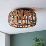 Endon Bracken bamboo flush ceiling light in natural finish, woven drum shade with single E27 lamp casting a striped glow across the ceiling.