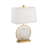 The Orivane 1 Light Circular Alabaster Table Lamp features a brass base, soft white rectangular shade, and a bold circular alabaster accent framed in brass at the center.