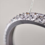 Close-up of the Bramcombe Pendant showing a matt black curved ring edge lined with clear faceted acrylic crystals against a plain light background.
