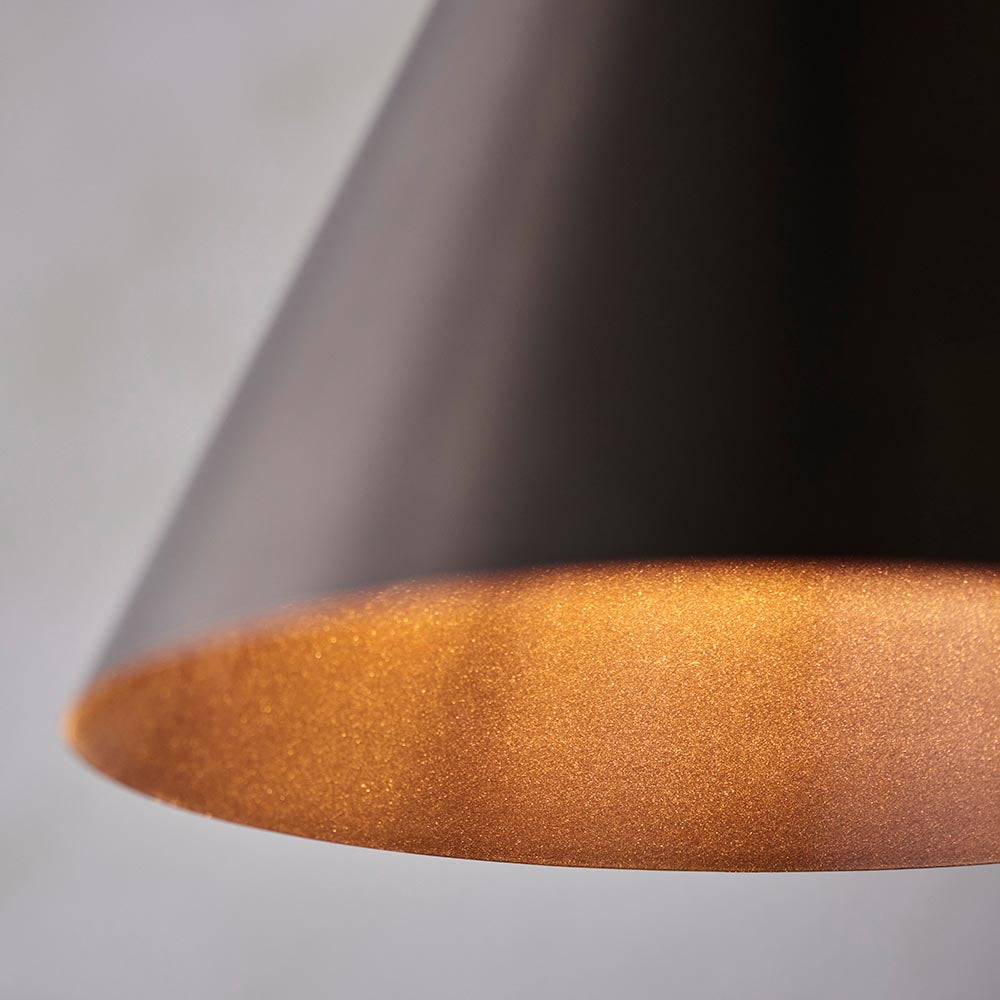 Close-up of the Endon Ashworth pendant light showing the matte bronze conical metal shade with a warm painted inner in a matching bronze finish.