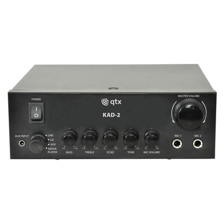 Front view of a QTX KAD-2 Digital Stereo Amplifier in black. This compact amplifier delivers a maximum output of 55W and includes a power button, multiple input options such as Line, CD, Aux, and Media Player. It also features knobs for adjusting bass, treble, echo, tone, and microphone volume with two microphone inputs.