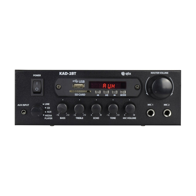 QTX KAD-2BT Bluetooth Class D stereo amplifier in matt black with power switch, input selector, USB and SD slots, tone knobs, mic inputs and master volume dial.