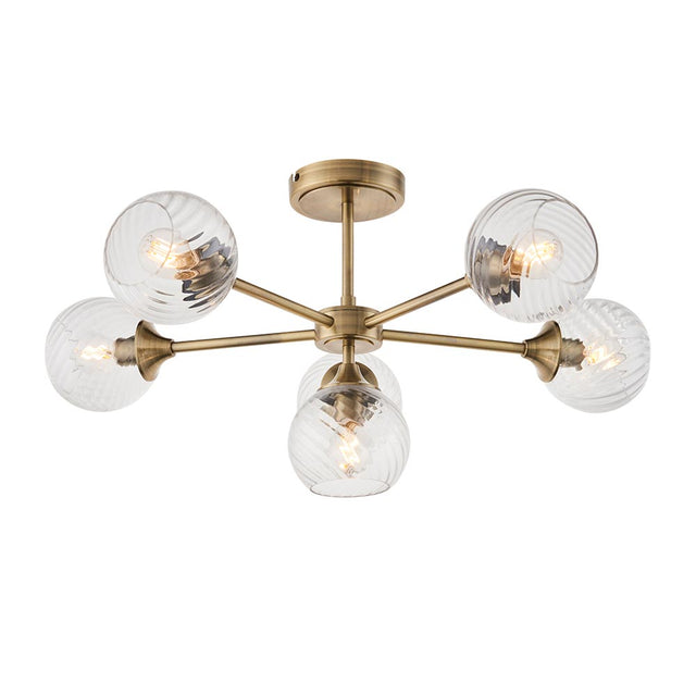 Endon Georgiana 6 light semi-flush ceiling light in brass, with six ribbed clear glass globe shades on radiating arms around a central plate.