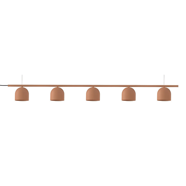 Rio 9 Linear 5 Light Dome Chandelier in terracotta, a slim iron rail with five small dome shades suspended on thin cords, shown on a plain white background.
