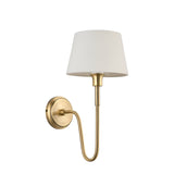 Endon Cliffdon wall light with curved antique brass arm and tapered ivory fabric shade on a plain white background.