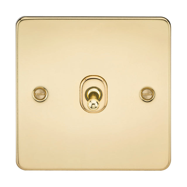 The 10AX 1 Gang 2-Way Toggle Switch in polished brass features a square, ultra-low profile design with a central toggle and two visible screws. This flat plate switch is minimal and elegant, showcasing a smooth, reflective surface.