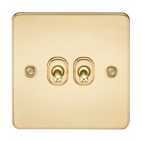 The 10AX 2 Gang 2-Way Toggle Switch in polished brass features a minimalist design with double toggle switches at the center, each sitting on a rounded base. This flat plate is secured by two side screws, offering a sleek addition to any room.