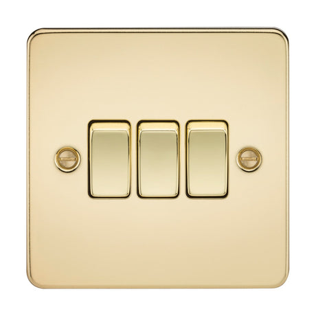 The 10AX 3 Gang 2-Way Switch in a polished brass finish features a gold-colored, ultra-low profile flat plate design. The switches are arranged vertically on a square plate, secured with two visible screws.