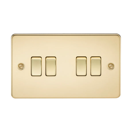 The 10AX 4 Gang 2-Way Switch in polished brass features an ultra-low profile and includes three horizontally arranged toggle switches. The panel has a sleek, reflective surface with two visible screws for mounting on either side.