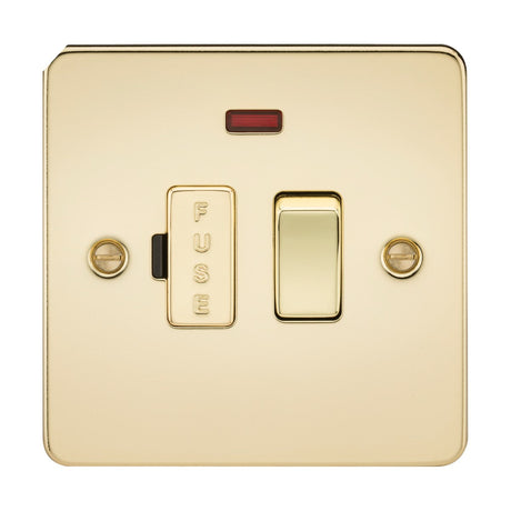 The 13A Switched Fused Spur Unit Neon in polished brass features a square design with a built-in fuse and a small red indicator light above it. The word "FUSE" is displayed on the left switch, which is flanked by two screws. This ultra-low-profile unit seamlessly combines design with functionality.