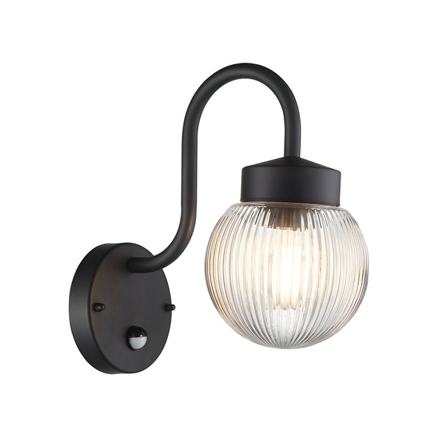 Endon Brackgrove outdoor wall light in black with arched arm, ribbed clear glass globe shade and integrated PIR sensor on the round backplate.