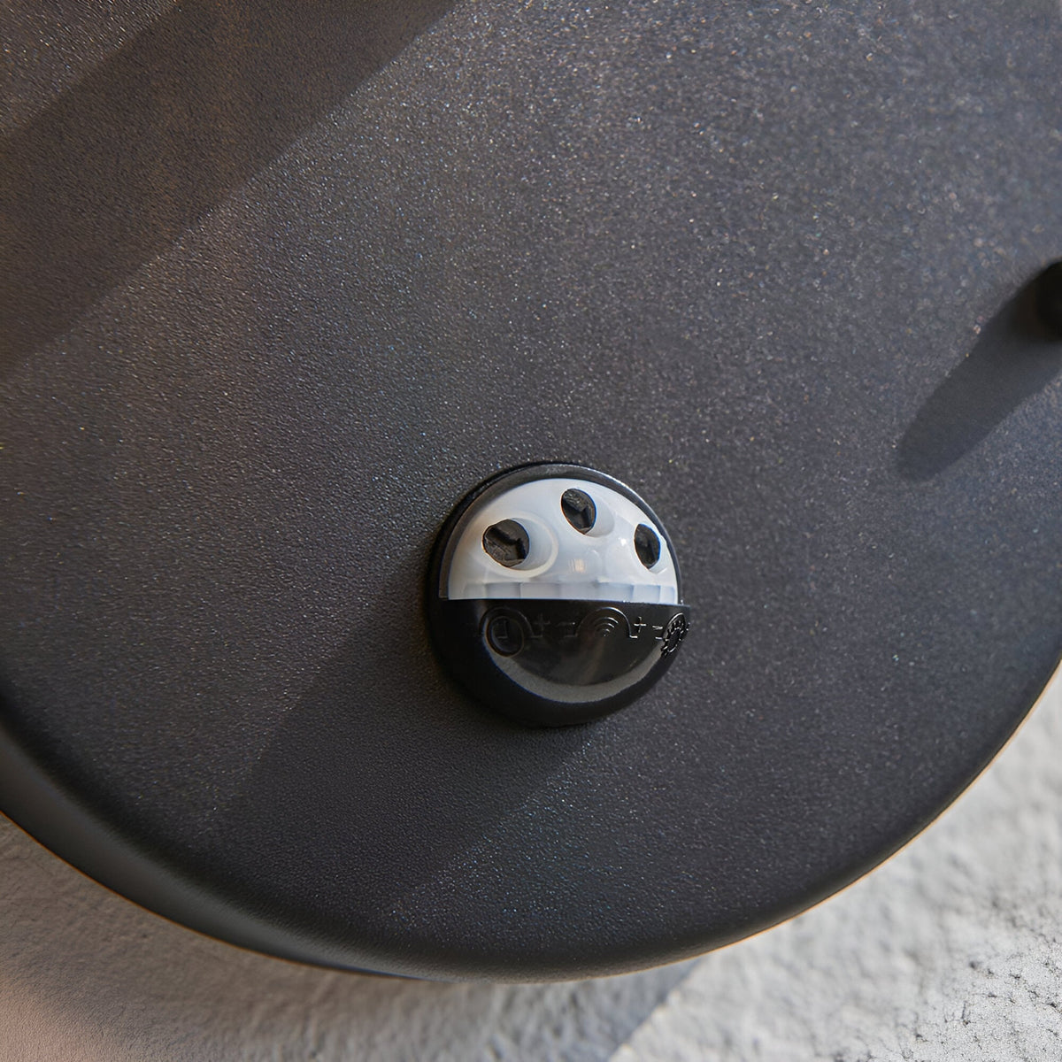 Close-up of the adjustable PIR sensor on the underside of the Endon Brackgrove outdoor wall light, showing timer and light-level controls in black.