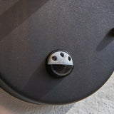 Close-up of the adjustable PIR sensor on the underside of the Endon Brackgrove outdoor wall light, showing timer and light-level controls in black.