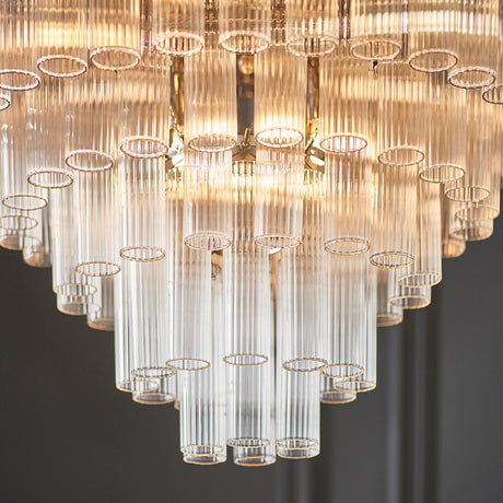 Close-up of Endon Cranshaw 12 Light Tiered Pendant in polished chrome, showing layered ribbed clear glass cylinders arranged in descending tiers.