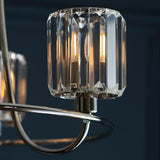 Close-up of the Clementine 3 Light Semi-Flush Ceiling Light in nickel, showing faceted glass shades with visible bulbs on curved metal arms.