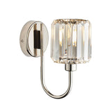 Endon Clementine wall light in nickel with a single faceted clear glass shade on a curved plated metal arm and round backplate, on a white background.