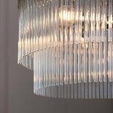 Close-up of the Beaumont 5 Light Pendant in nickel, showing tiered clear glass rods diffusing warm light from the E14 bulbs.