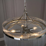Beaumont 5 Light Pendant in nickel, close-up of the glass rod drum shade and central five-arm frame with lit bulbs, hung from a chain.