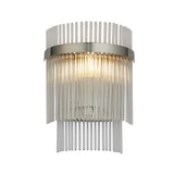 Endon Beaumont wall light in nickel with tiered clear glass rods around a lit E14 bulb on a curved plated backplate, shown on a white background.