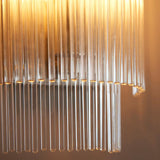 Close-up of Endon Beaumont wall light in nickel showing clear glass rods in tiered rows glowing warmly around the E14 lamp.
