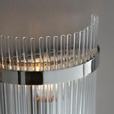 Close-up of Endon Beaumont wall light in nickel, showing polished chrome-effect band and clear glass rods glowing softly around a single E14 lamp.