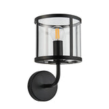 Endon Ellery wall light in matt black with a clear glass cylindrical shade and E14 filament bulb, mounted on a round backplate against a white background.