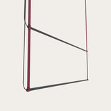 René Duo Horizontal LED Linear Pendant Light in burgundy, two angled matte black bars suspended between slim burgundy cords, shown against a plain light background.