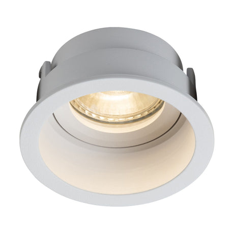 A minimalist white Dipa Single Fixed Recessed Round Downlight with a cylindrical shape and a warm glowing bulb, designed for subtle illumination to create an elegant atmosphere.
