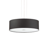 The Noble 5 Light Pendant - Black features a sleek black design with a chromed metal frame and a wide, cylindrical shade. It is elegantly suspended from thin strings over a white setting, with an acid-etched glass diffuser underneath the shade.