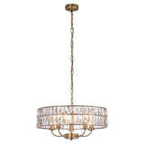 Bevmont 5 Light Pendant in antique brass with a drum-shaped frame of faceted crystal glass, suspended on an adjustable chain against a plain white background.